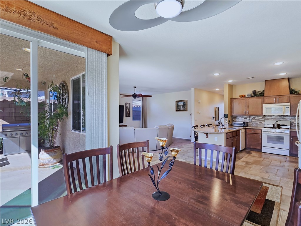 2485 Morrow Ridge Place Laughlin, NV 89029 - Photo 40 of 40 An open floor plan seamlessly connects the kitchen and dining areas, with convenient outdoor access.