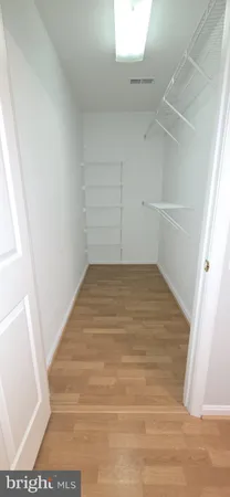 a view of a room with white walls