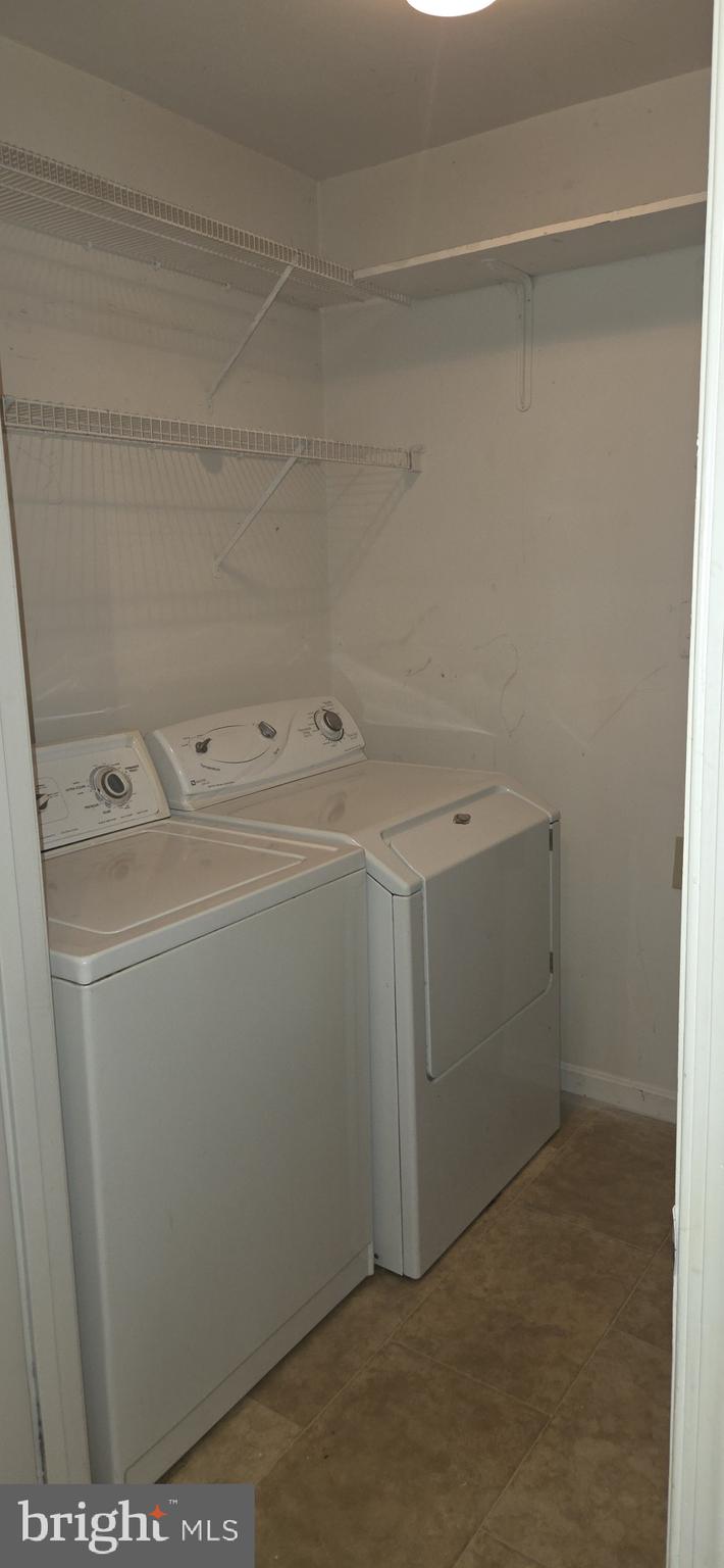 11192 Rienzi Place, Unit 102 Manassas, VA 20109 - Photo 18 of 19 a utility room with dryer and washer