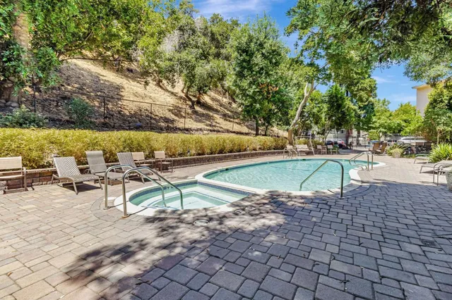 a view of a swimming pool with a patio