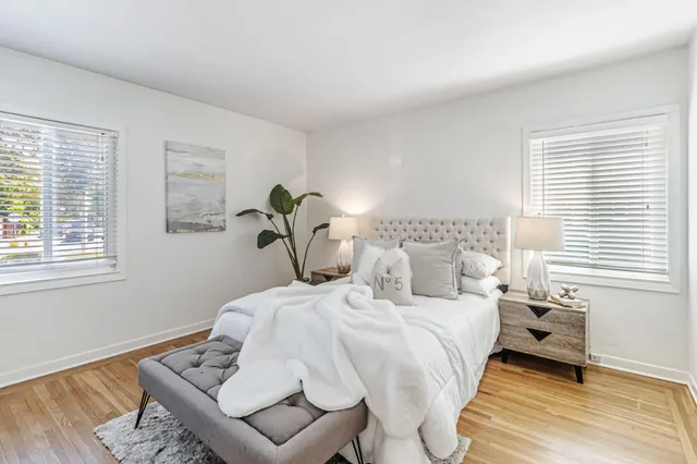 a bedroom with a bed and window