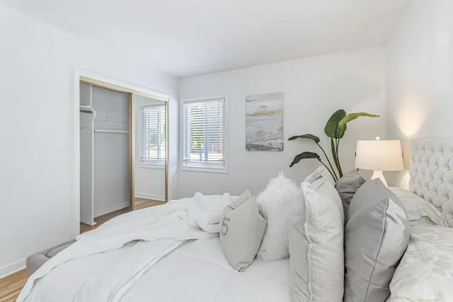 a bedroom with a bed and a couch