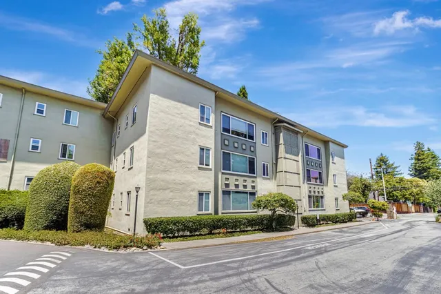 an aerial view of a house with a yard and garden