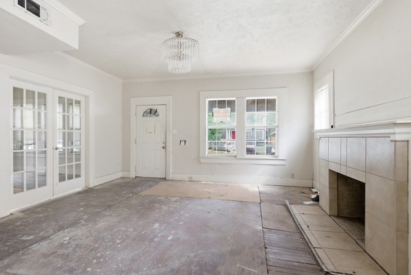 1655 Hawthorne Street Houston, TX 77006 - Photo 15 of 39 an empty room with windows and fireplace