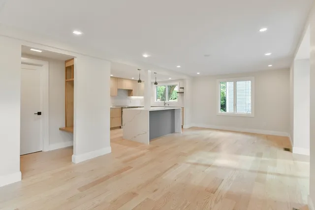 a view of a kitchen with a sink and a window
