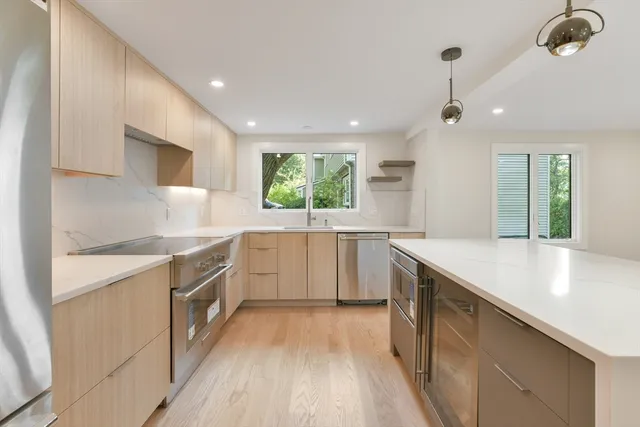 a kitchen with a sink stove and cabinets
