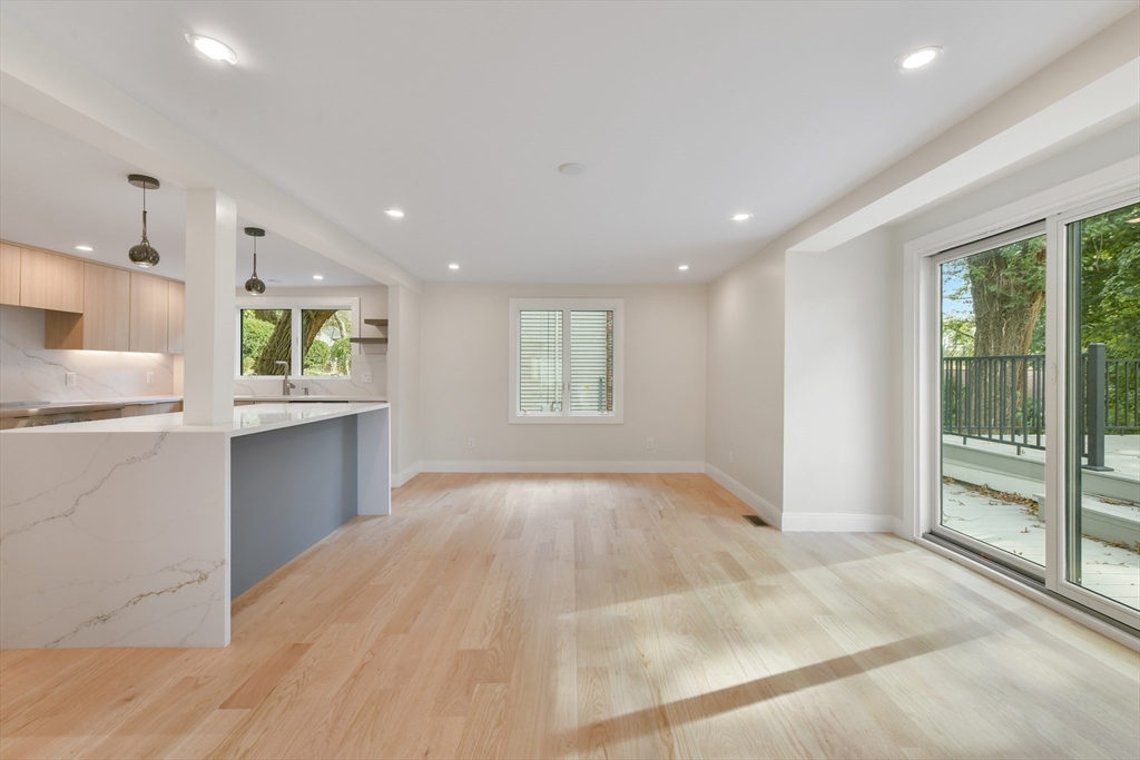 72 Wallis Road Brookline, MA 02467 - Photo 16 of 42 a view of an empty room with kitchen and window