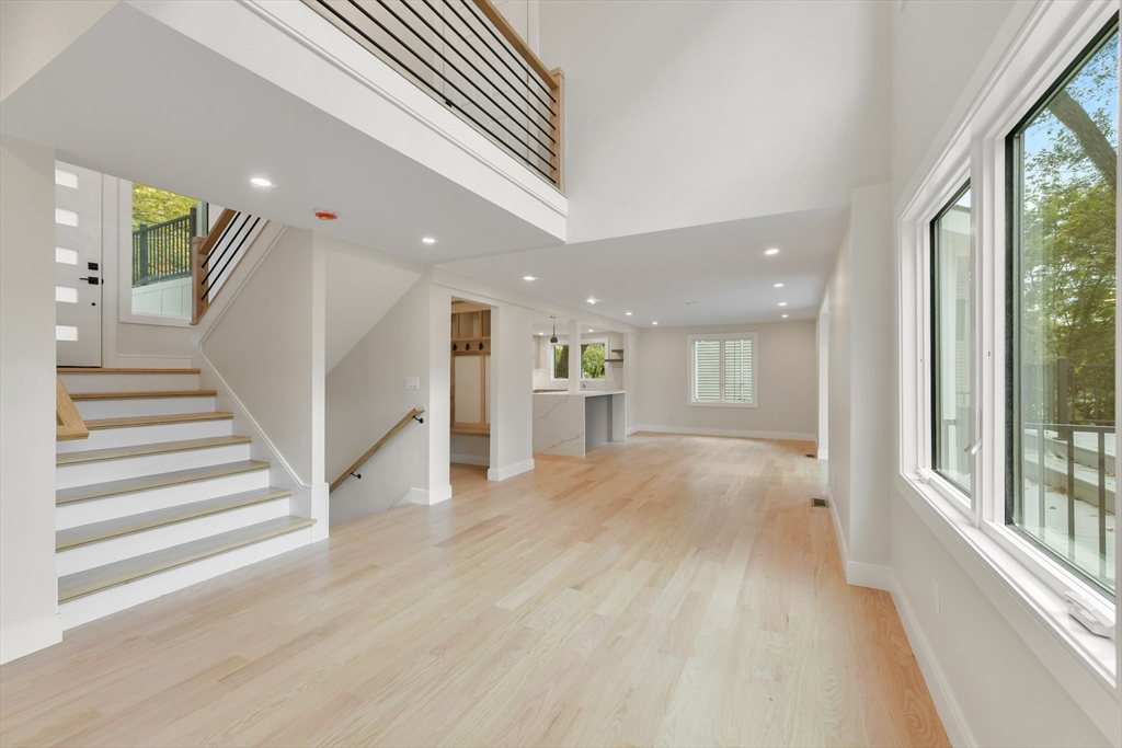 72 Wallis Road Brookline, MA 02467 - Photo 19 of 42 a view of entryway and hall with wooden floor