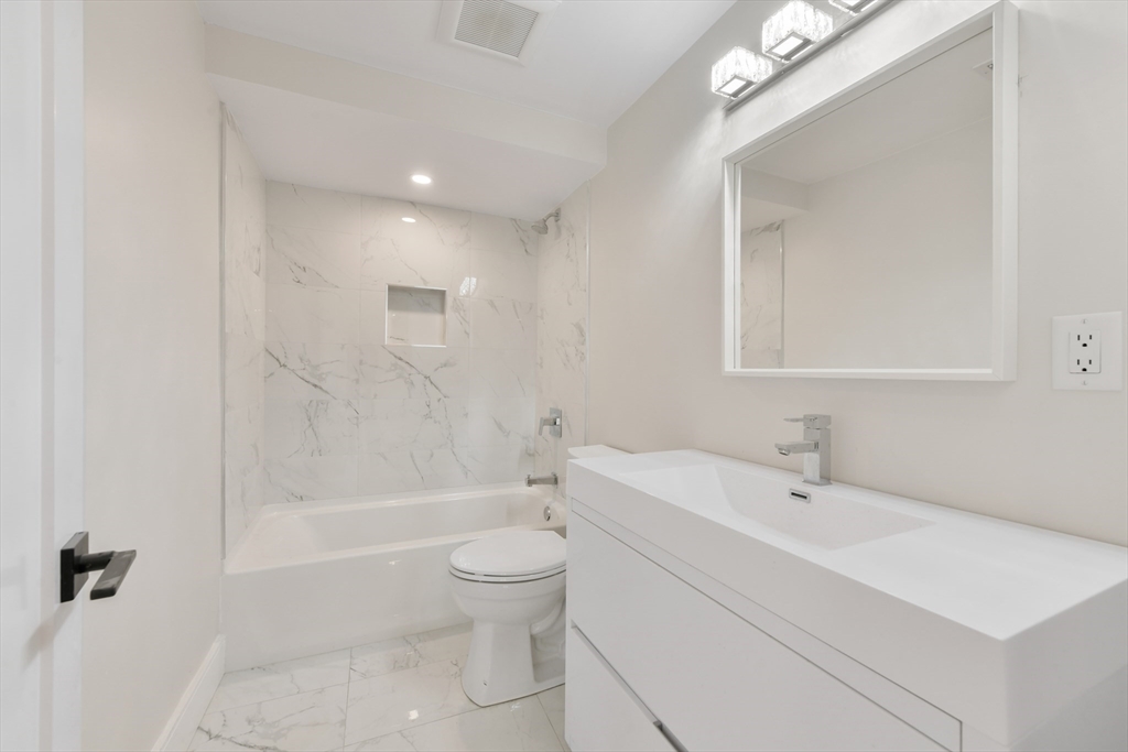 72 Wallis Road Brookline, MA 02467 - Photo 26 of 42 a bathroom with a sink toilet and shower