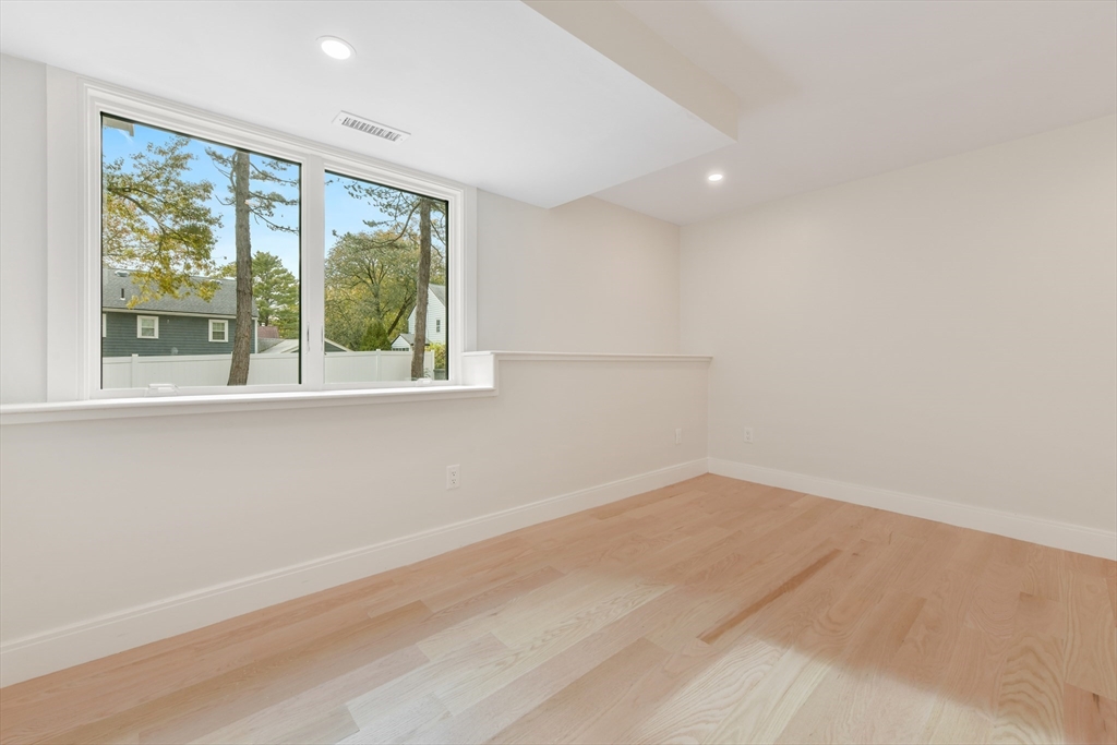 72 Wallis Road Brookline, MA 02467 - Photo 30 of 42 an empty room with a window
