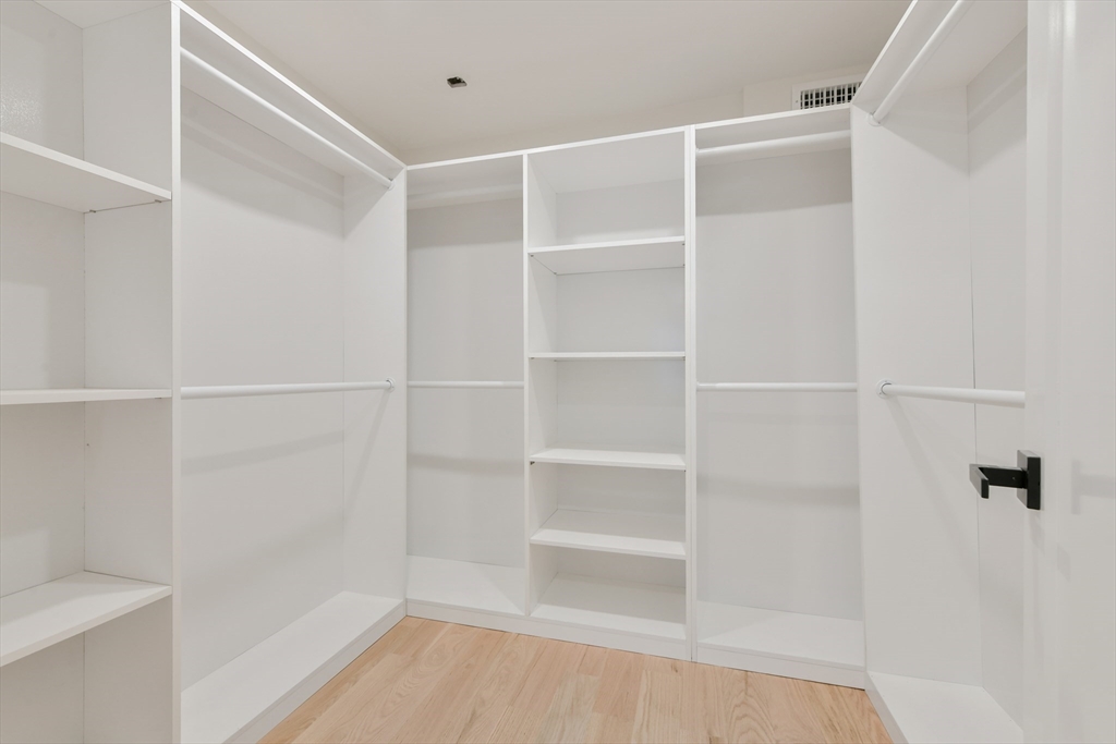 72 Wallis Road Brookline, MA 02467 - Photo 32 of 42 a view of walk in closet with empty racks
