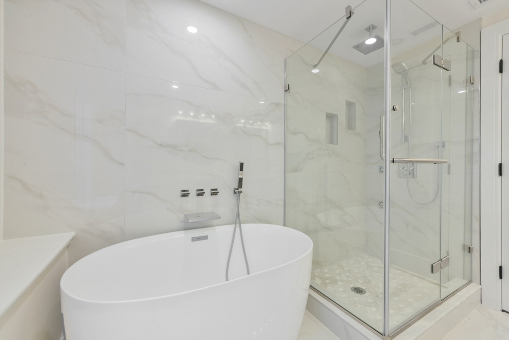 72 Wallis Road Brookline, MA 02467 - Photo 33 of 42 a bathroom with a bathtub and a shower