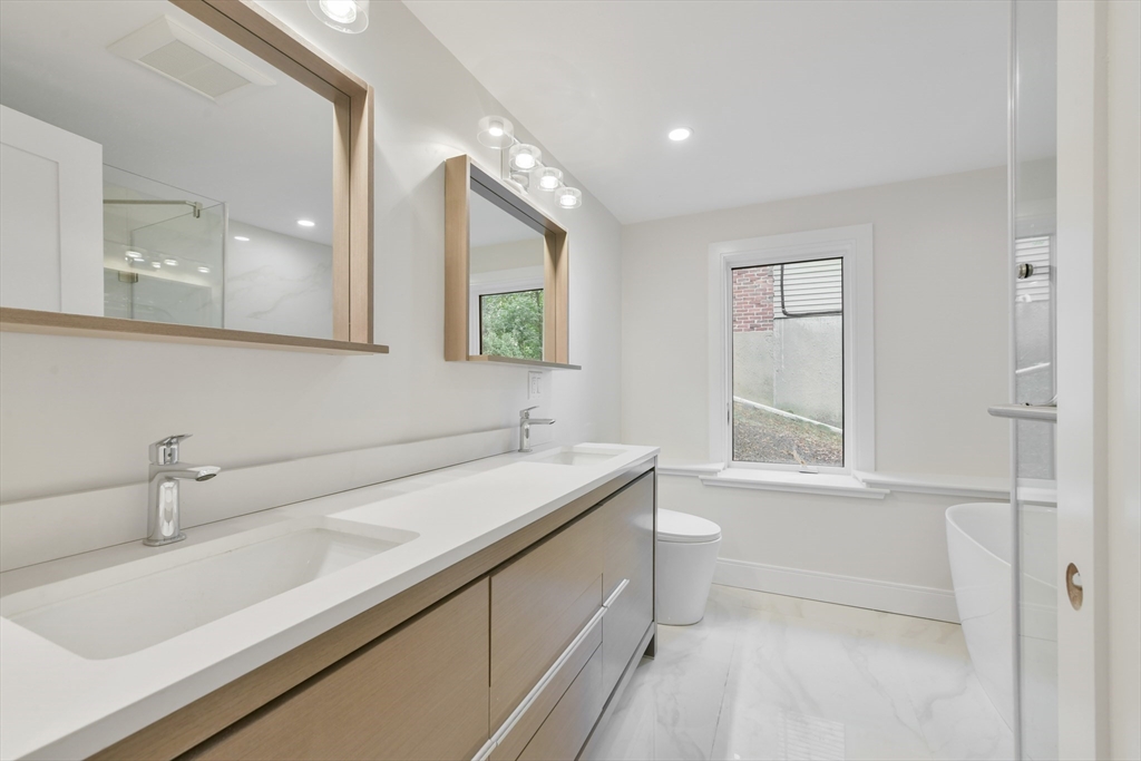 72 Wallis Road Brookline, MA 02467 - Photo 34 of 42 a bathroom with a sink and a toilet