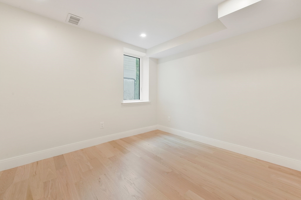 72 Wallis Road Brookline, MA 02467 - Photo 35 of 42 an empty room with a window