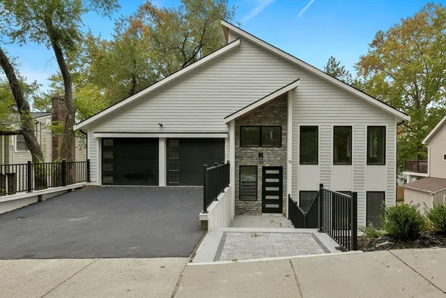 a front view of a house with a garage