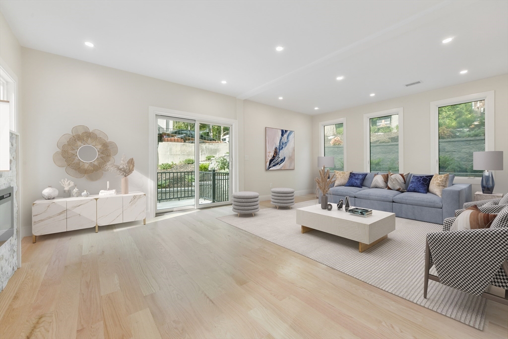 72 Wallis Road Brookline, MA 02467 - Photo 9 of 42 a living room with furniture and a large window