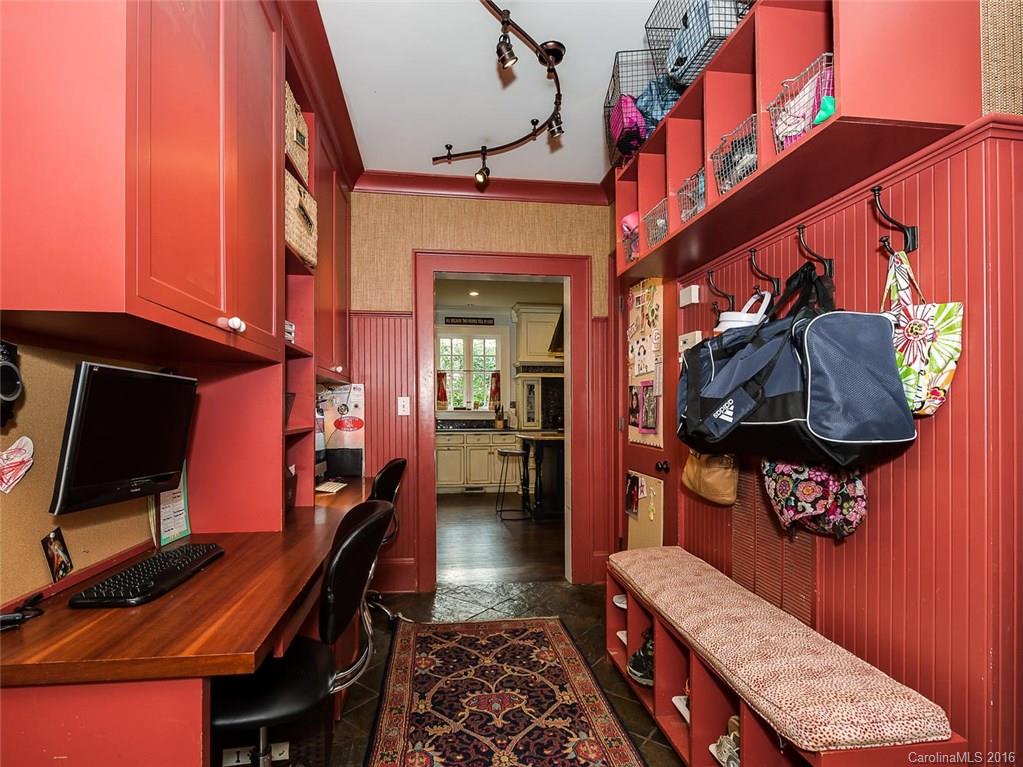 728 Berkeley Avenue Charlotte, NC 28203 - Photo 11 of 24 a bedroom with a bed and a flat tv screen on the dresser
