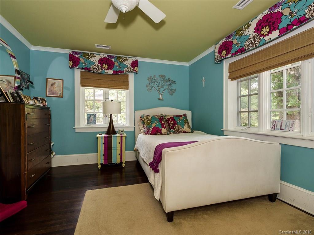 728 Berkeley Avenue Charlotte, NC 28203 - Photo 17 of 24 a bedroom with a bed and a window