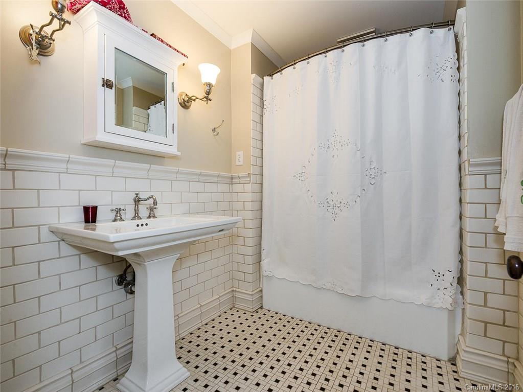 728 Berkeley Avenue Charlotte, NC 28203 - Photo 18 of 24 a bathroom with a sink a toilet and shower