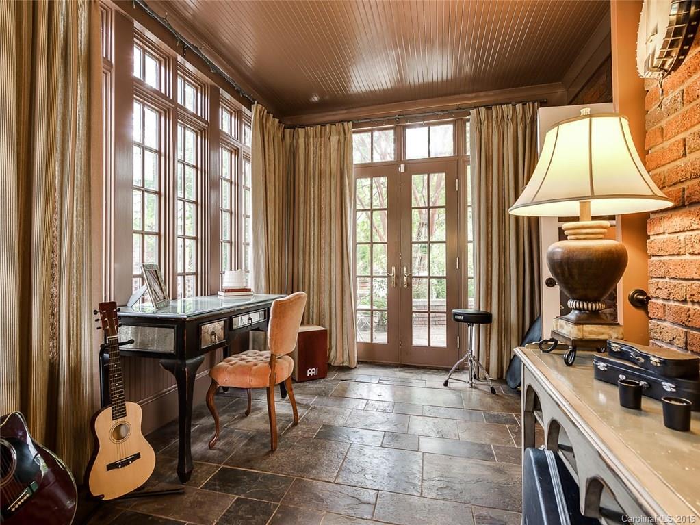 728 Berkeley Avenue Charlotte, NC 28203 - Photo 6 of 24 a view of a kitchen with dining table and chairs