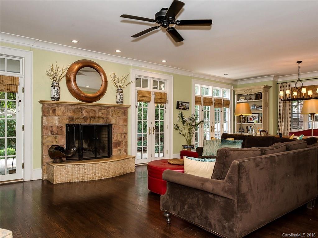 728 Berkeley Avenue Charlotte, NC 28203 - Photo 10 of 24 a living room with furniture a large window and a fireplace
