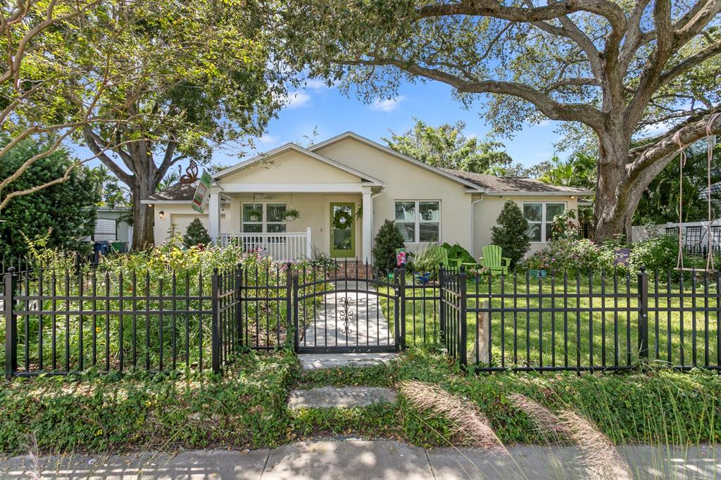 3910 West Tacon Street Tampa, FL 33629 - Photo 1 of 1 a front view of a house with a garden
