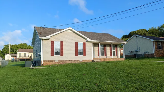 front view of a house with a yard