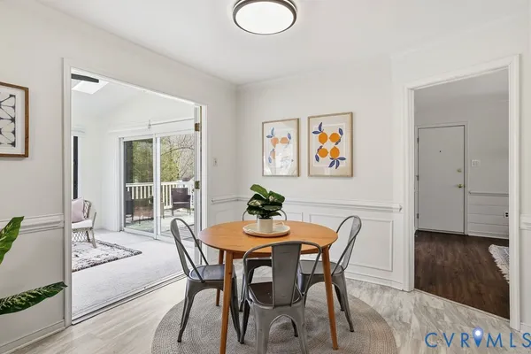 a dining room with furniture and window