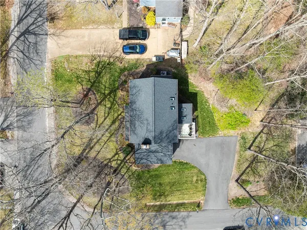a aerial view of a house with a yard