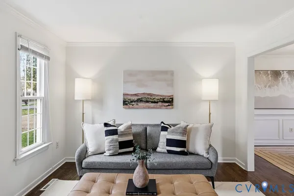 a living room with furniture large window and lamp