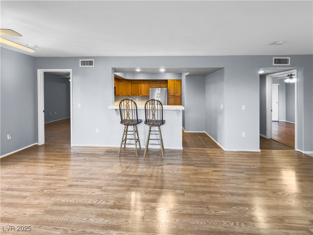 7950 West Flamingo Road, Unit 1169 Las Vegas, NV 89147 - Photo 41 of 42 Open floor plan with breakfast bar/sitting