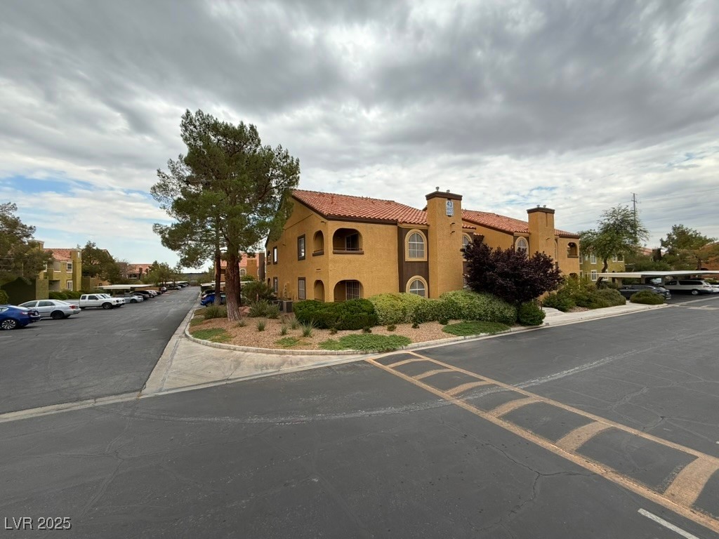7950 West Flamingo Road, Unit 1169 Las Vegas, NV 89147 - Photo 25 of 42 Downstairs, corner lot with assigned cover parking & plenty of guest parking