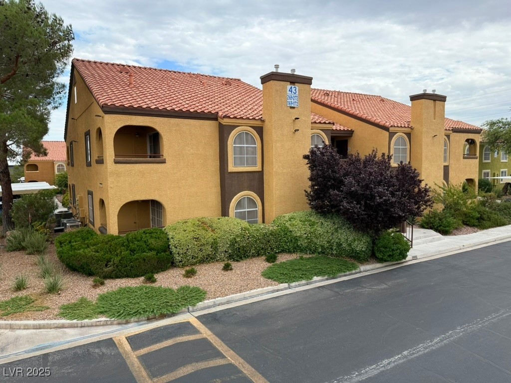 7950 West Flamingo Road, Unit 1169 Las Vegas, NV 89147 - Photo 26 of 42 Downstairs, corner lot with assigned cover parking & plenty of guest parking