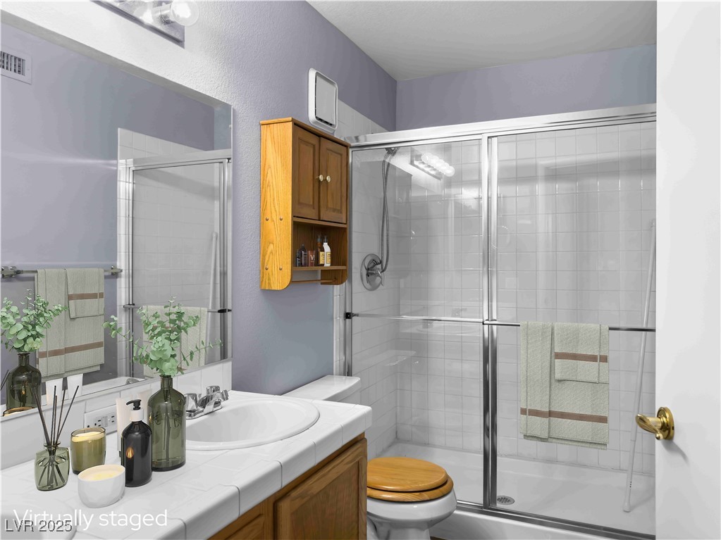 7950 West Flamingo Road, Unit 1169 Las Vegas, NV 89147 - Photo 3 of 42 Primary bathroom with double sinks. Virtually staged.