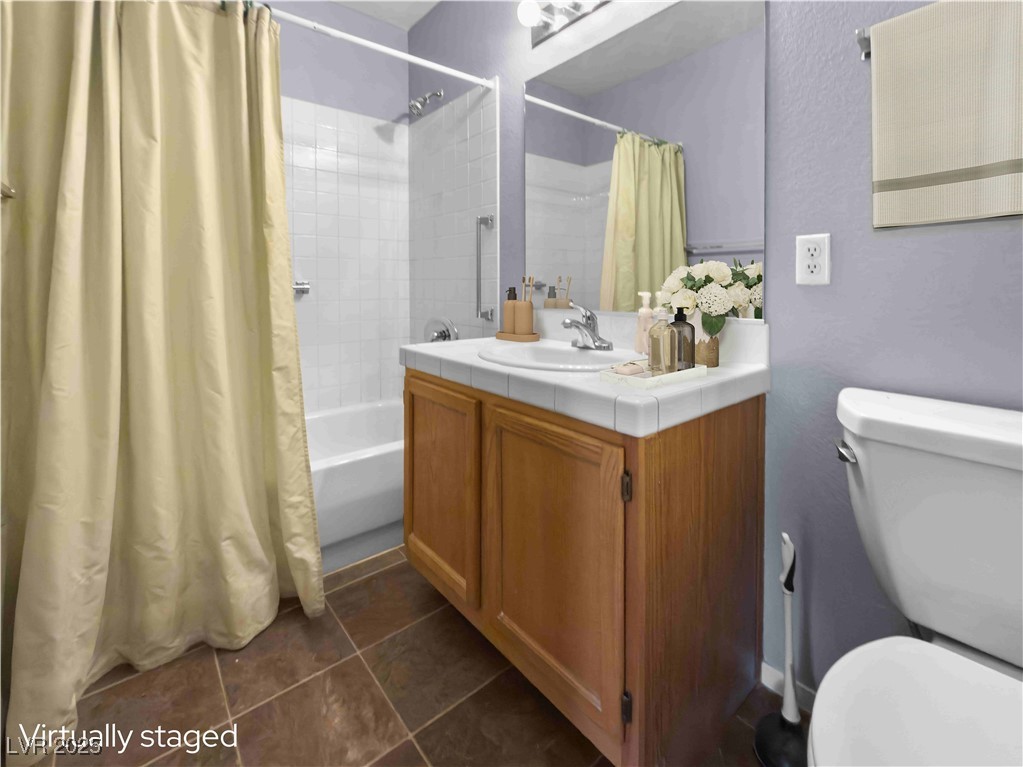7950 West Flamingo Road, Unit 1169 Las Vegas, NV 89147 - Photo 6 of 42 2nd bathroom with access from hallway & 2nd bedroom. Virtually staged.