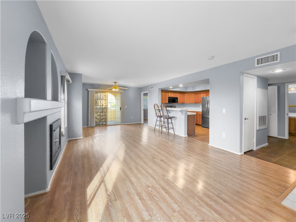 7950 West Flamingo Road, Unit 1169 Las Vegas, NV 89147 - Photo 7 of 42 Living room open to dining room & kitchen
