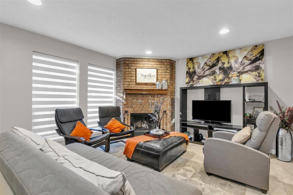 7670 Kings Ridge Road Frisco, TX 75035 - Photo 11 of 24 Living area featuring a fireplace and recessed lighting