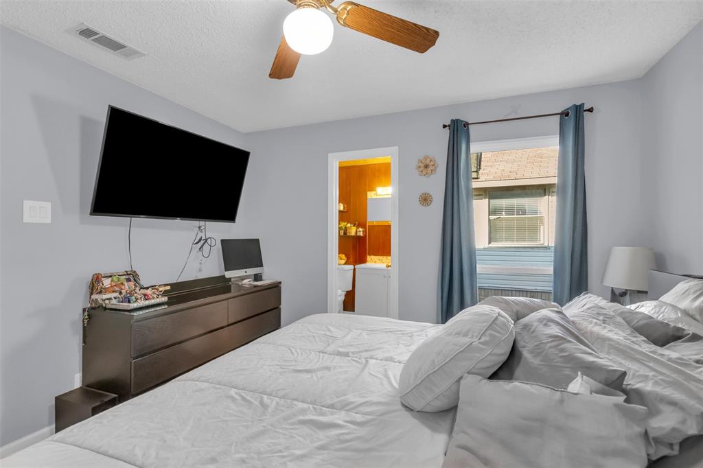 7670 Kings Ridge Road Frisco, TX 75035 - Photo 16 of 24 Bedroom featuring a ceiling fan, a textured ceiling, and ensuite bathroom