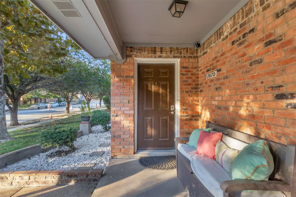 7670 Kings Ridge Road Frisco, TX 75035 - Photo 5 of 24 View of exterior entry with brick siding and covered porch