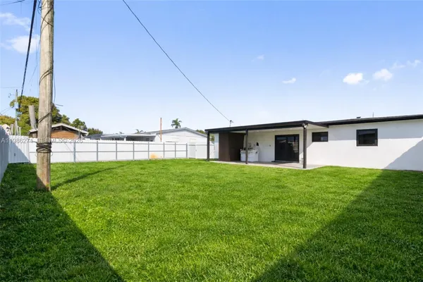a view of a backyard of the house