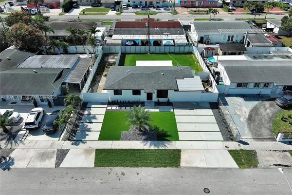 an aerial view of a house with a garden