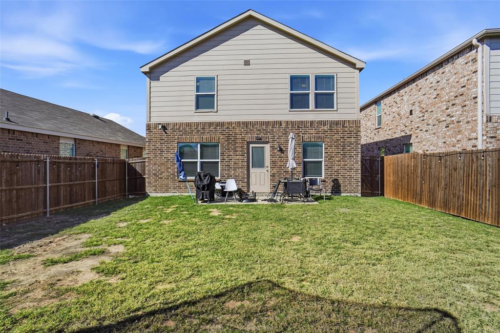 1719 Ackerly Drive Forney, TX 75126 - Photo 24 of 27 a view of a house with backyard