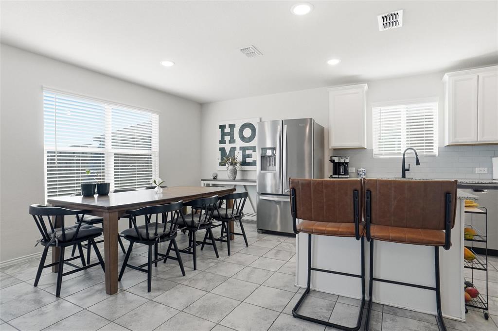 1719 Ackerly Drive Forney, TX 75126 - Photo 8 of 27 a view of a dining room with furniture