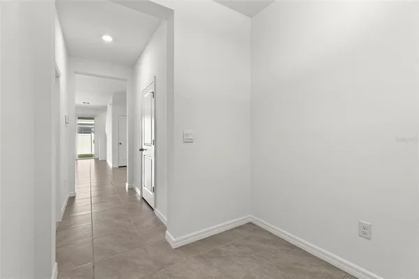 a view of a hallway with a room