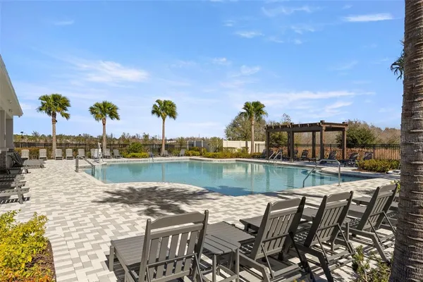 a view of a swimming pool with a lounge chair