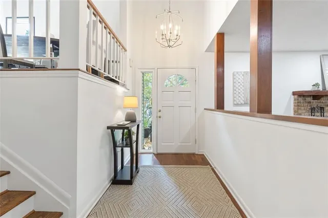 a view of a hallway with windows and stairs