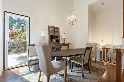 a view of a dining room with furniture window and wooden floor