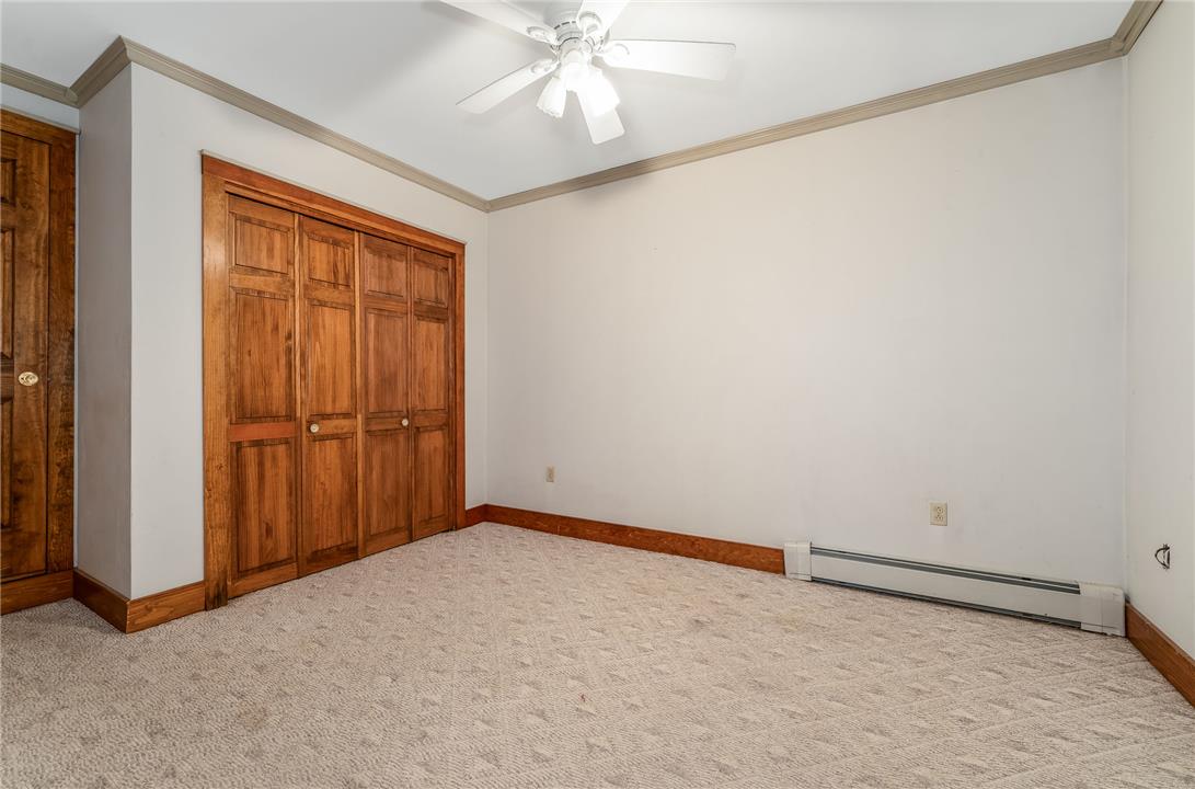 465 Raubsville Road Easton, PA 18042 - Photo 47 of 60 A well-proportioned bonus room in the basement with ample storage and a ceiling fan offers and seperate zoned heat. comfortable living.
