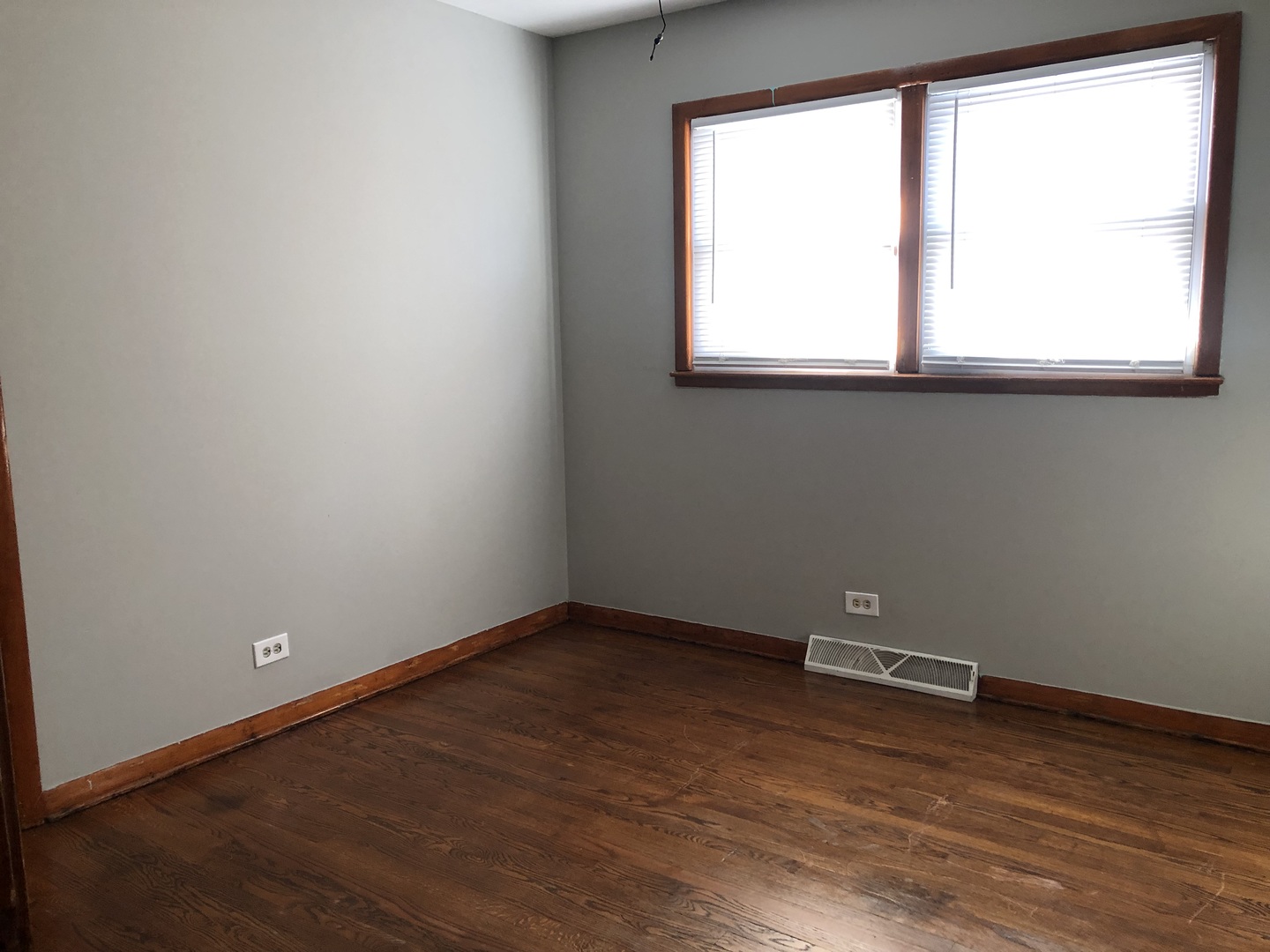 3851 153rd Place Midlothian, IL 60445 - Photo 5 of 13 an empty room with wooden floor and a window