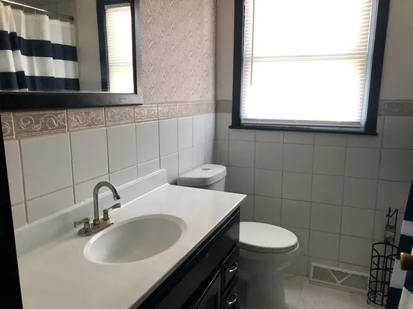 a bathroom with a sink and a toilet